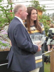 Rachel de Thame with John prodly displaying the Diamond Jubilee bowl