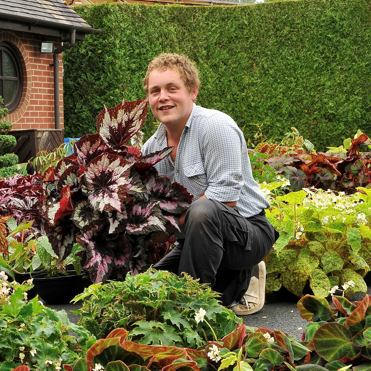 Adam Greathead holding plants